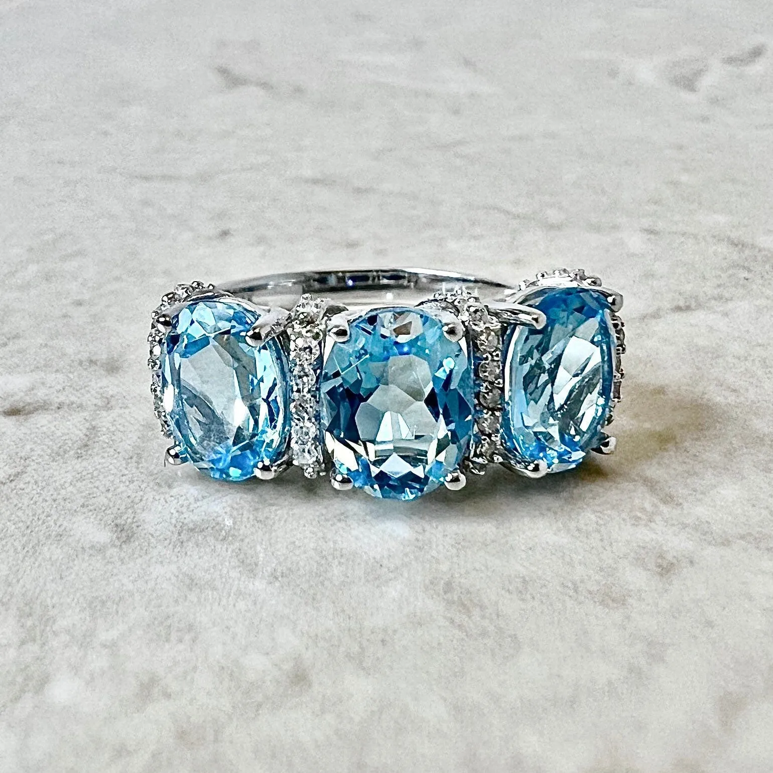 14 Karat White Gold Oval Swiss Blue Topaz & Diamond Three-Stone Ring