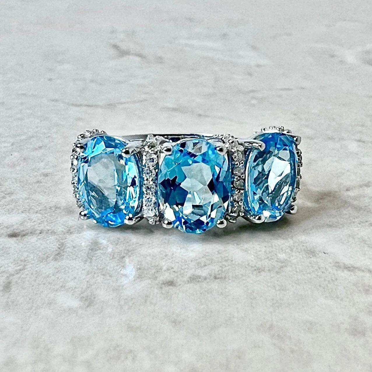 14 Karat White Gold Oval Swiss Blue Topaz & Diamond Three-Stone Ring