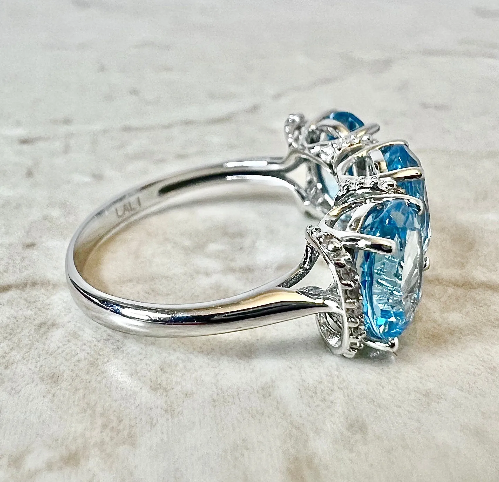 14 Karat White Gold Oval Swiss Blue Topaz & Diamond Three-Stone Ring