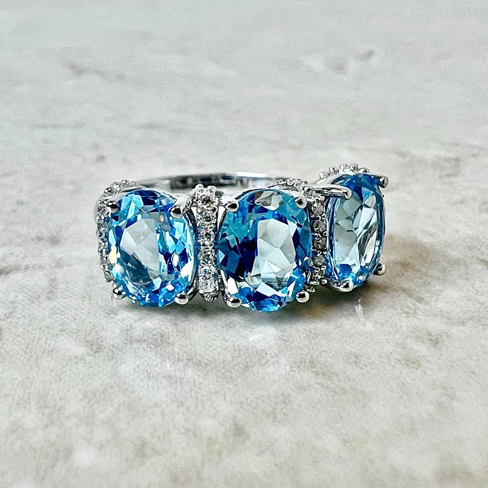 14 Karat White Gold Oval Swiss Blue Topaz & Diamond Three-Stone Ring