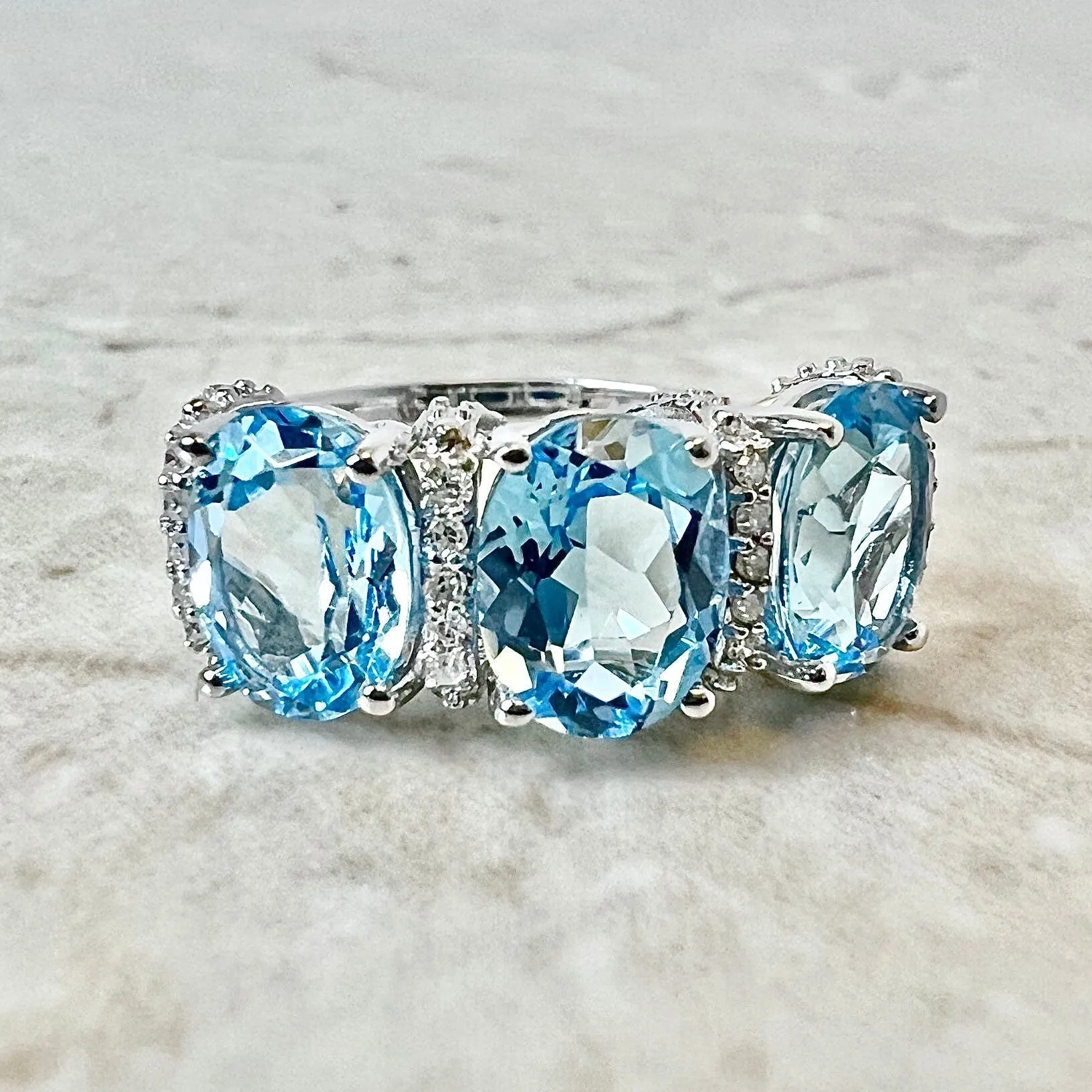 14 Karat White Gold Oval Swiss Blue Topaz & Diamond Three-Stone Ring