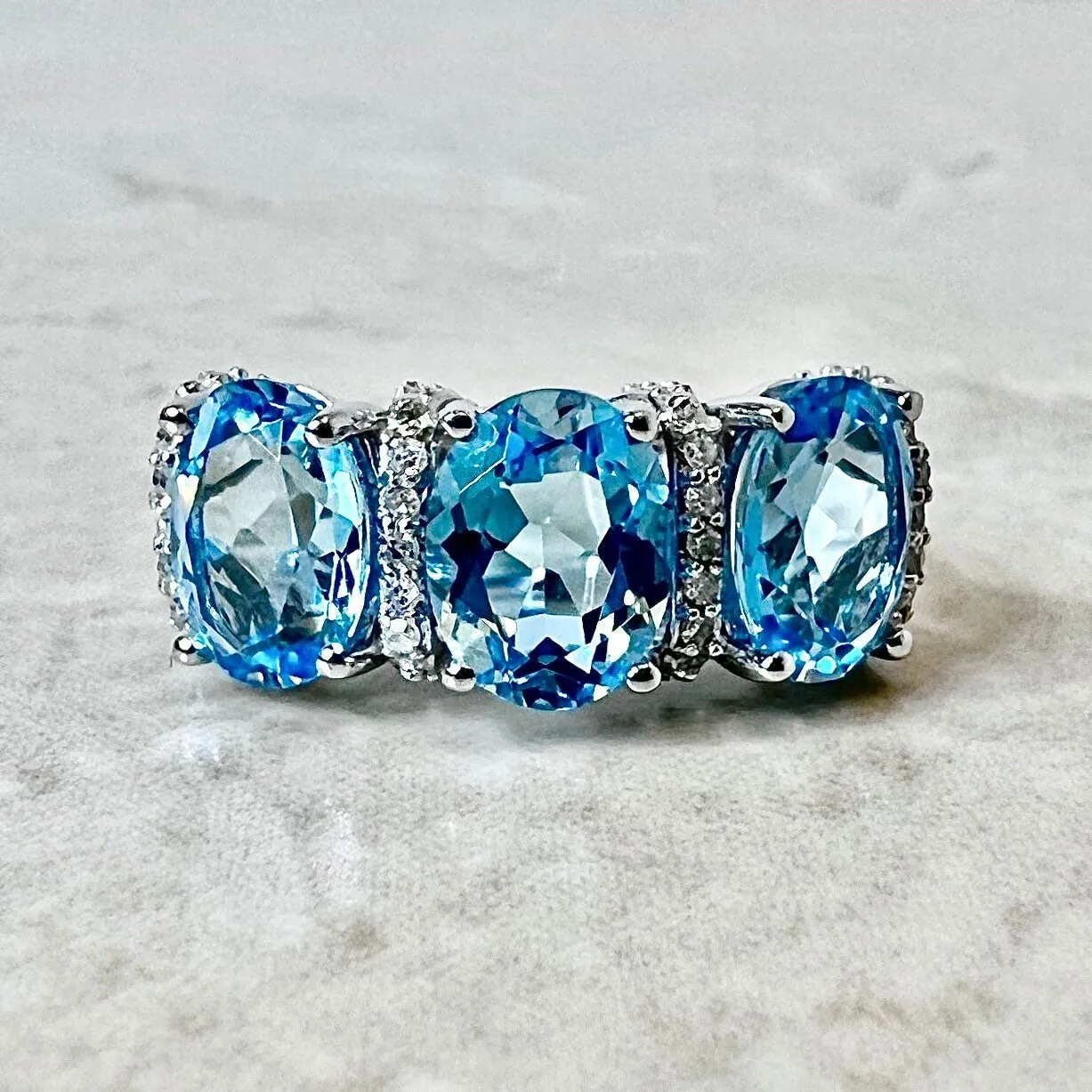 14 Karat White Gold Oval Swiss Blue Topaz & Diamond Three-Stone Ring