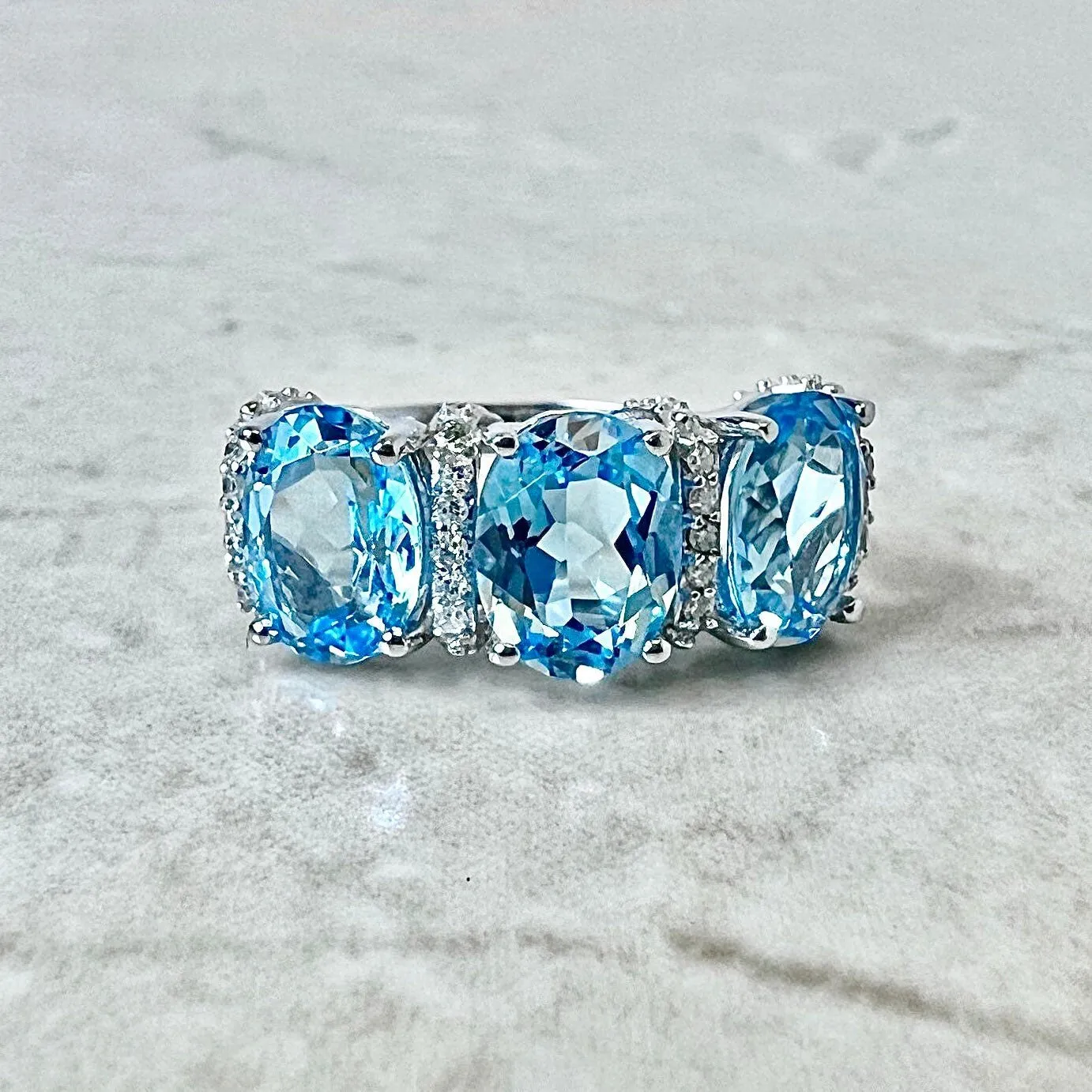 14 Karat White Gold Oval Swiss Blue Topaz & Diamond Three-Stone Ring