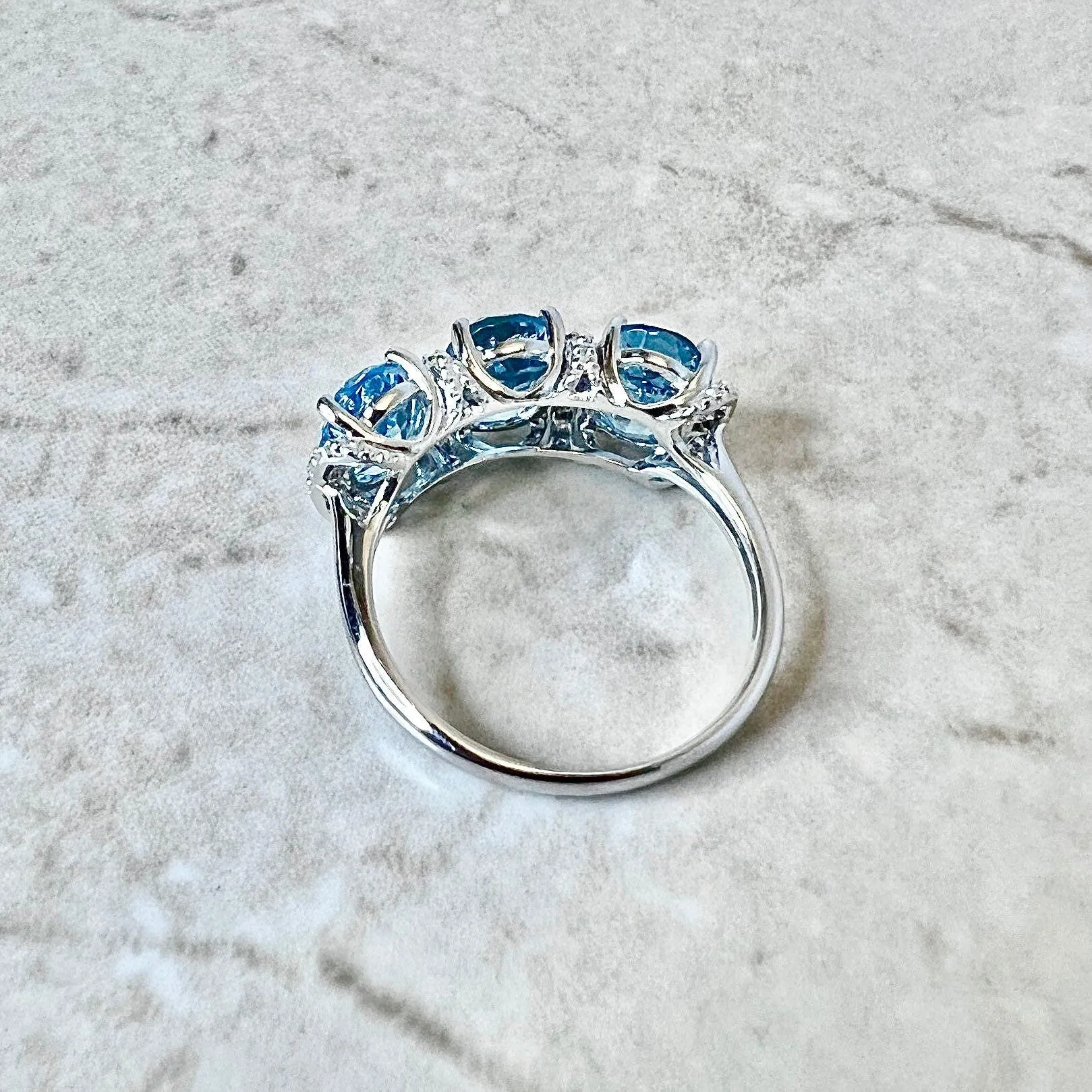 14 Karat White Gold Oval Swiss Blue Topaz & Diamond Three-Stone Ring