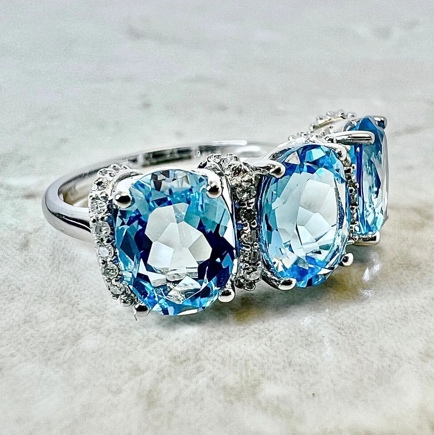 14 Karat White Gold Oval Swiss Blue Topaz & Diamond Three-Stone Ring