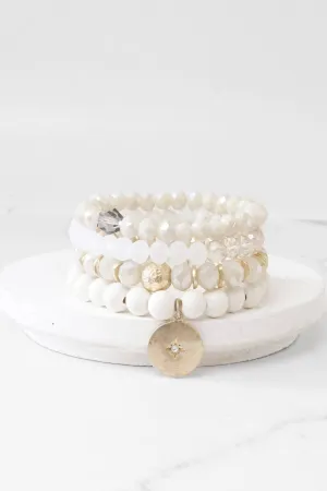 Beaded bracelets set in White Cream with a coin charm
