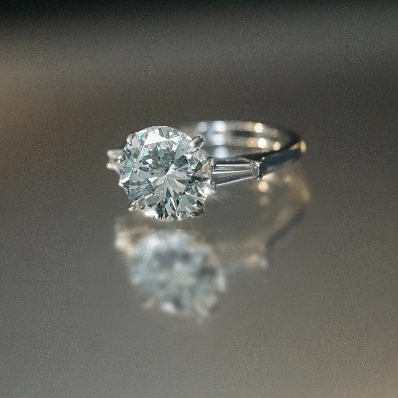 The Edelweiss Sunrise: Platinum 3.67 ct Round Brilliant and Tapered Baguette Diamond Ring