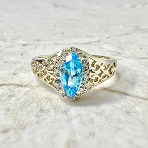 Vintage 14 Karat Yellow Gold Marquise Swiss Blue Topaz & Diamond Halo Ring