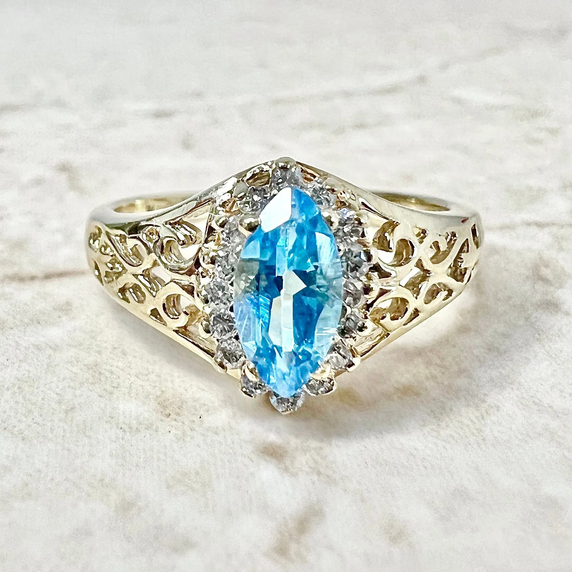 Vintage 14 Karat Yellow Gold Marquise Swiss Blue Topaz & Diamond Halo Ring
