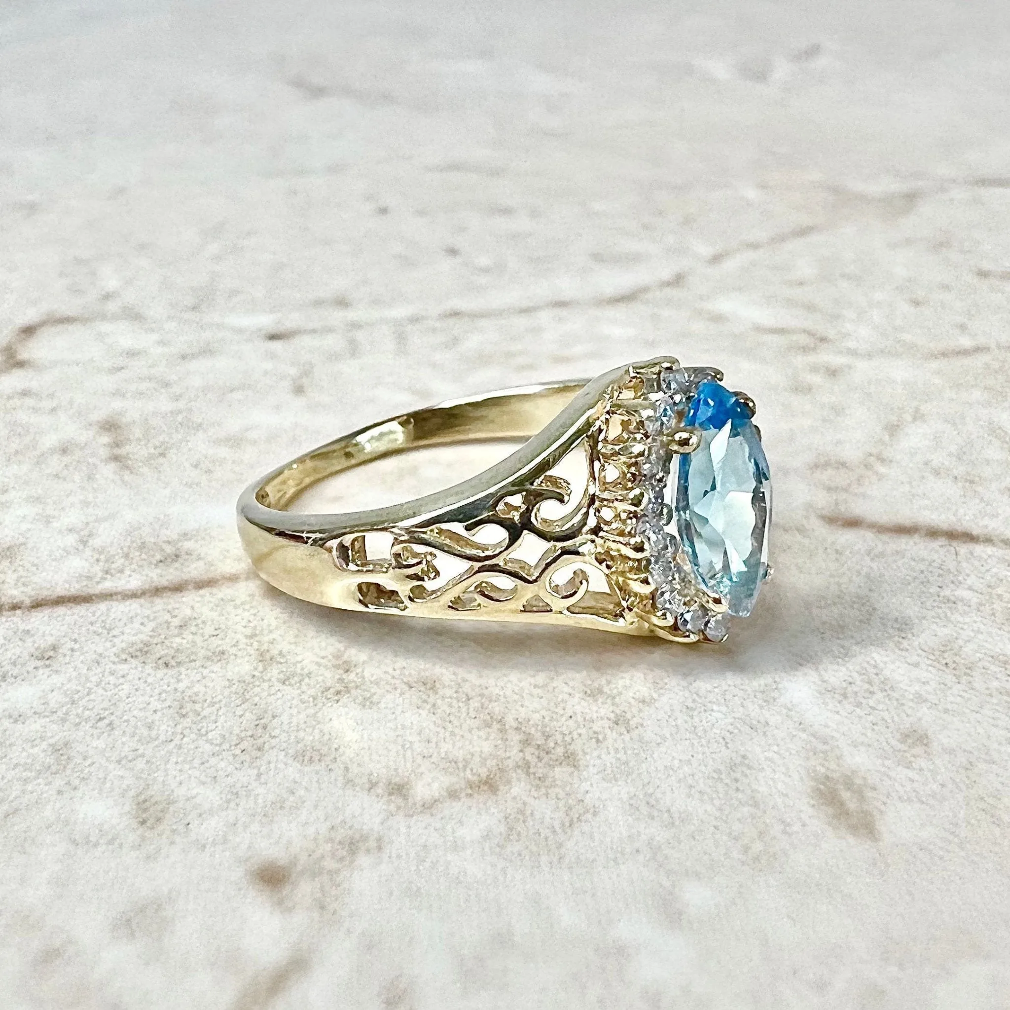 Vintage 14 Karat Yellow Gold Marquise Swiss Blue Topaz & Diamond Halo Ring