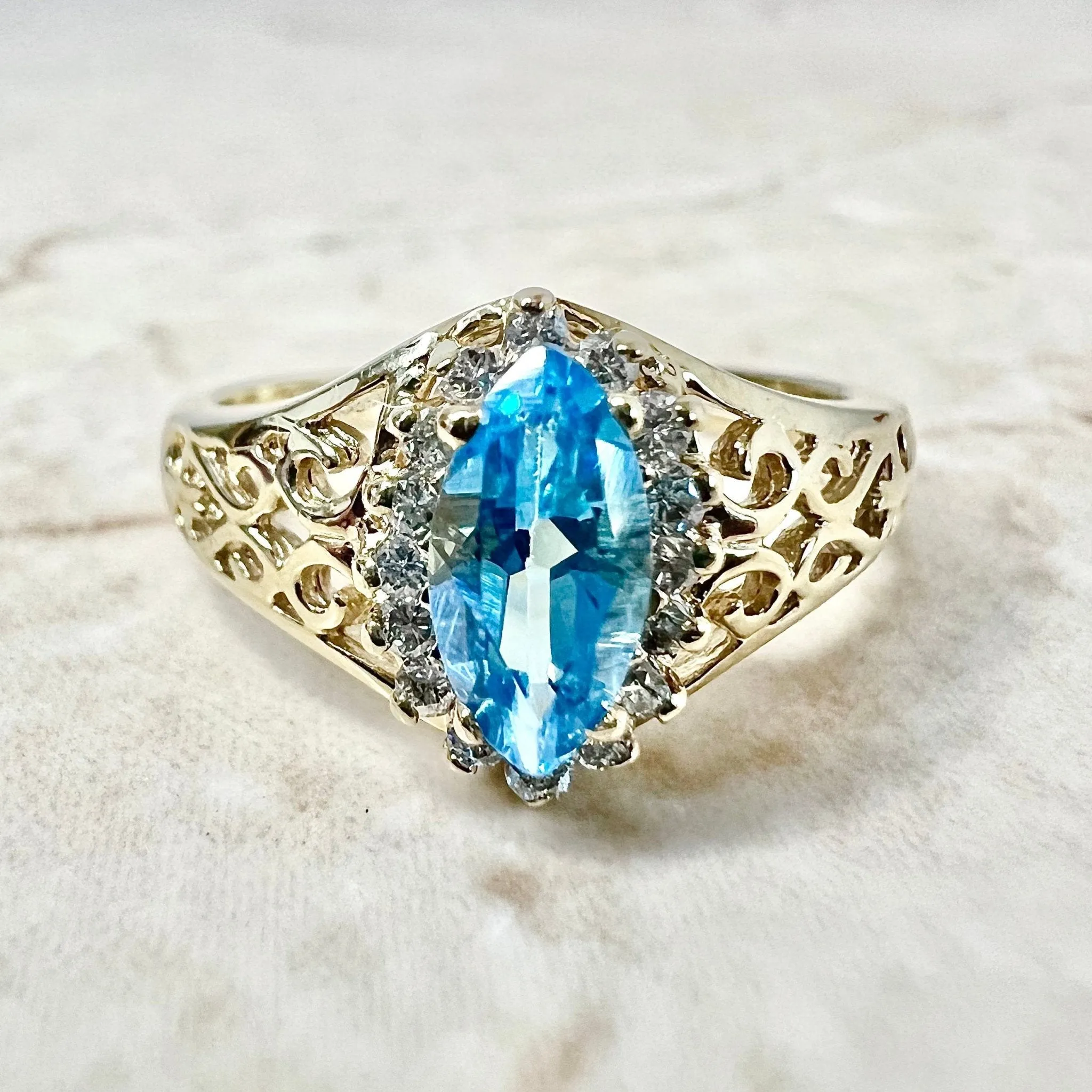 Vintage 14 Karat Yellow Gold Marquise Swiss Blue Topaz & Diamond Halo Ring